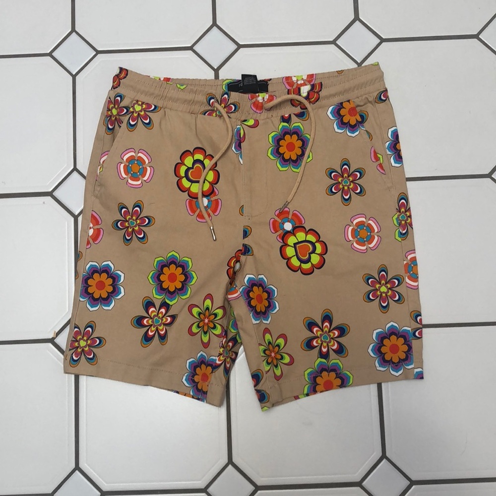 Brand new beige shorts with colorful flowers